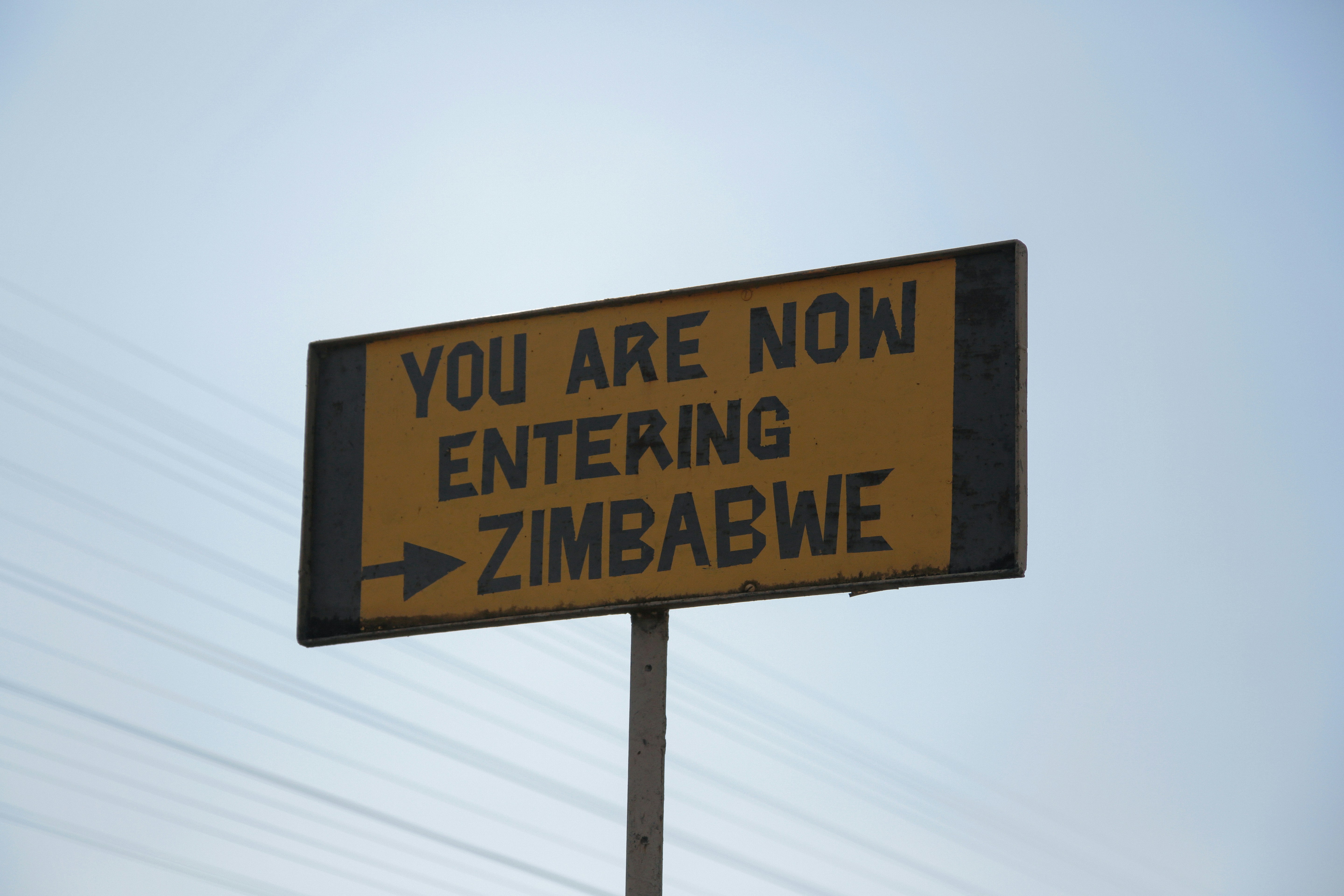 Border sign reading You Are Now Entering Zimbabwe